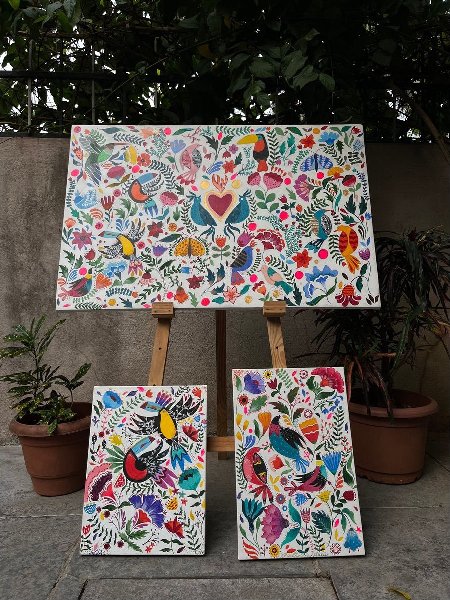 Floral canvases stacked in the courtyard